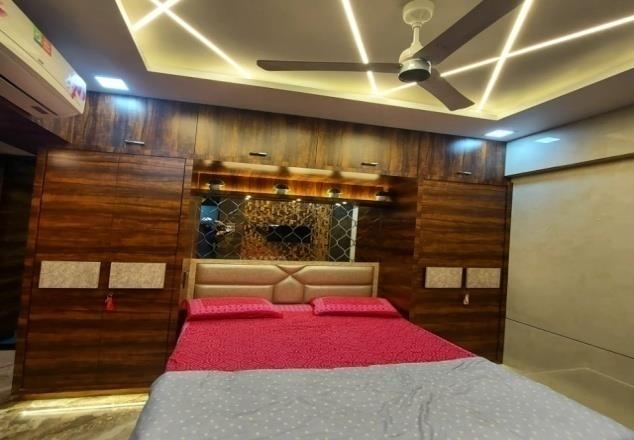Walnut bedroom with integrated storage and lighting